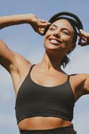 Woman smiling wearing a Samphire device