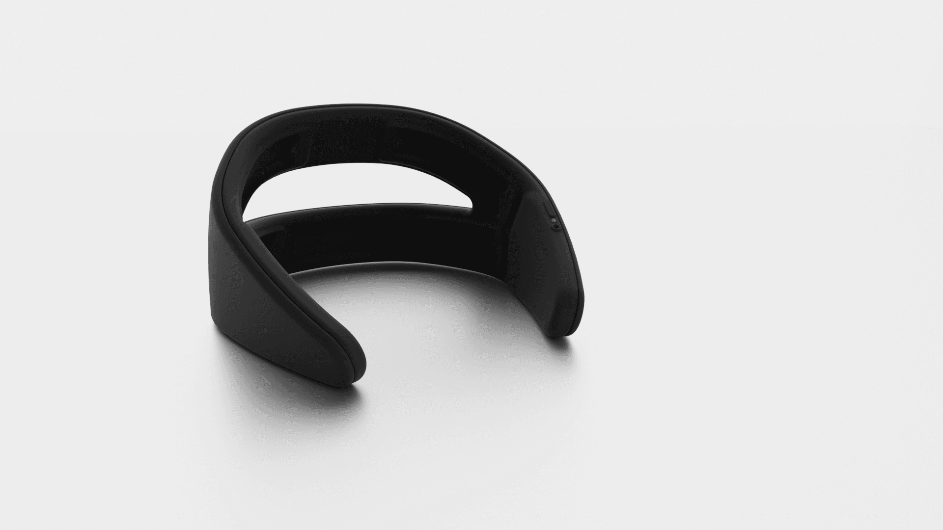 Black Lutea™ device sitting on grey background